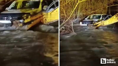 Çubuk'ta akıntıya kapılıp 150 metre sürüklenen araç iş makinasıyla durduruldu