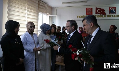 Pursaklar'da öğretmenlere kitap ve gül hediye edildi